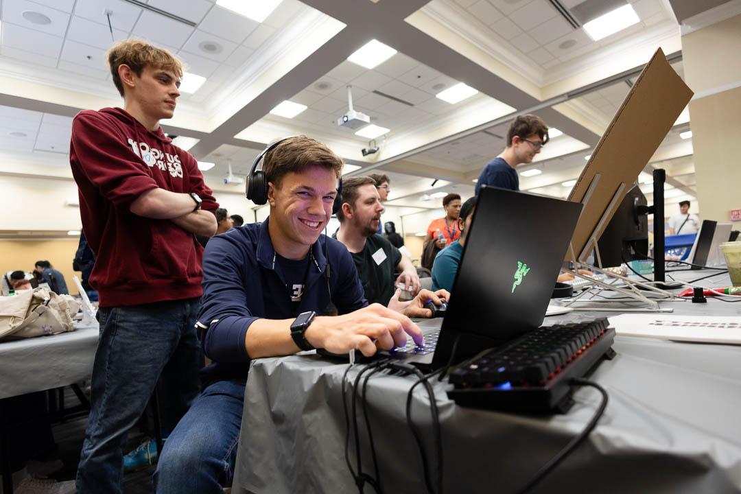 A Simulation and Game Development student shows off his skills at the Wake Tech Student Showcase.
